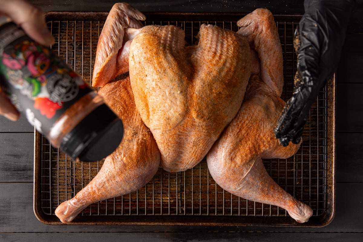 Apply the BBQ rub to the spatchcocked turkey